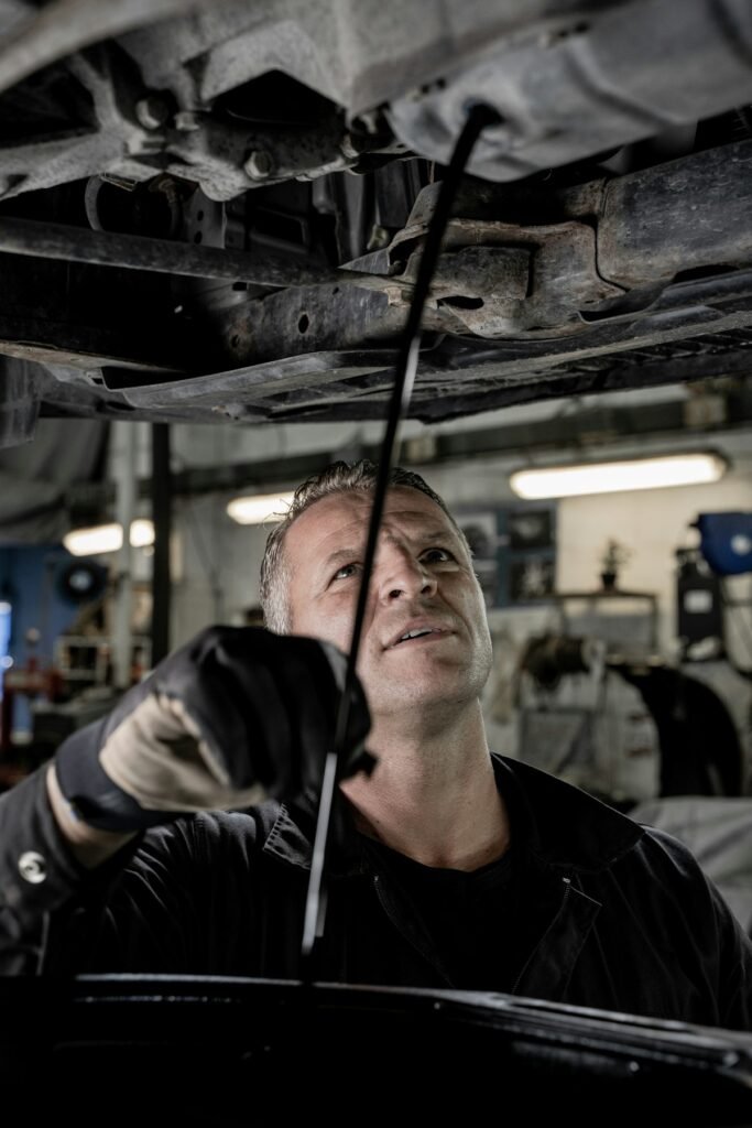 Gs-Spot Mags & Tyres workshop interior - mechanic working on vehicle